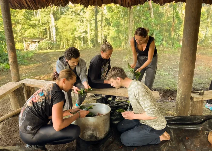 Ayahuasca cooking family Family cooking Ayahuasca for late night ceremony.